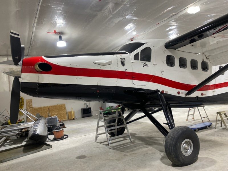 Turboprop aircraft parked inside a hangar